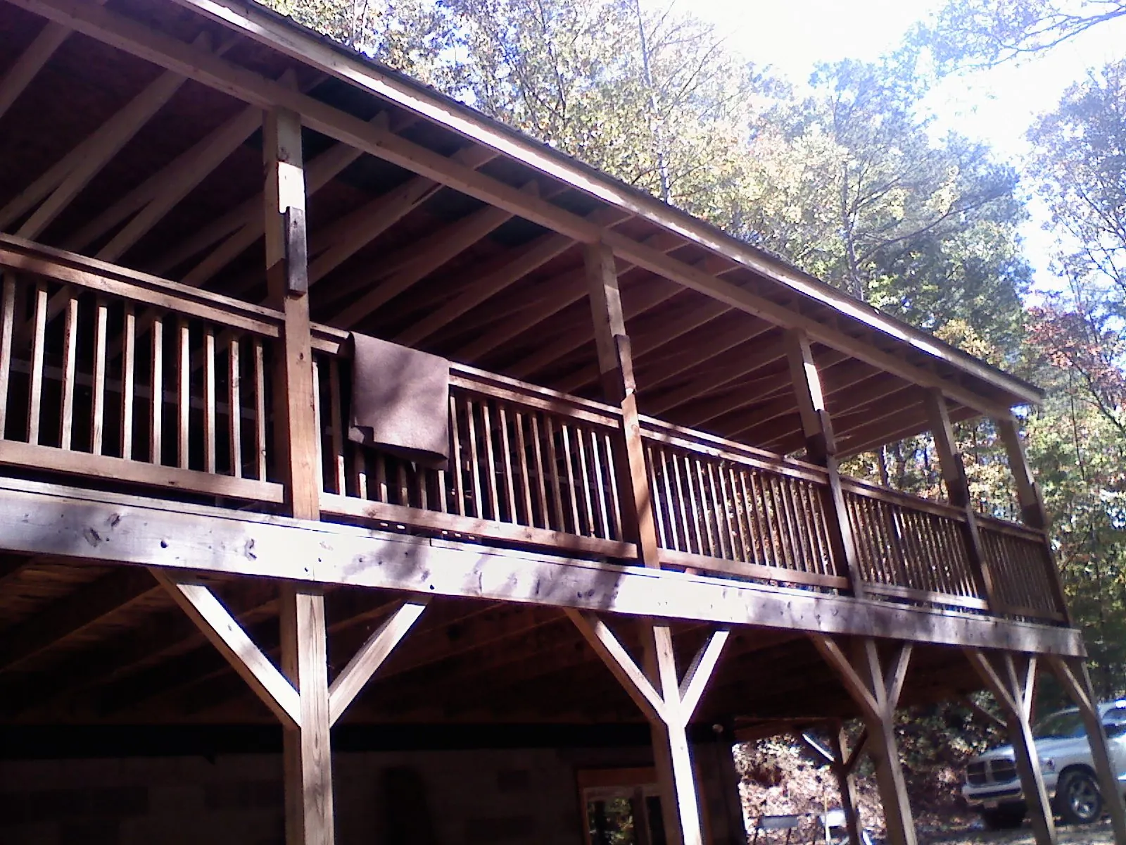 Timber framing under a new elevated porch and deck — Roof Leak Repair in North Hampton by Roofing Brothers